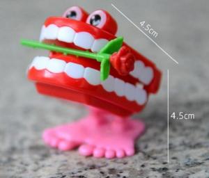 Quality HOT FUNNY JUMPING TEETH CHATTERING SMILE TEETH SMALL WIND UP FEET TOY for sale