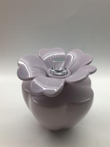 Quality Customized 100ml Spray Perfume Bottle Oval Glossy Blue Bottle Flower Shaped Cap for sale