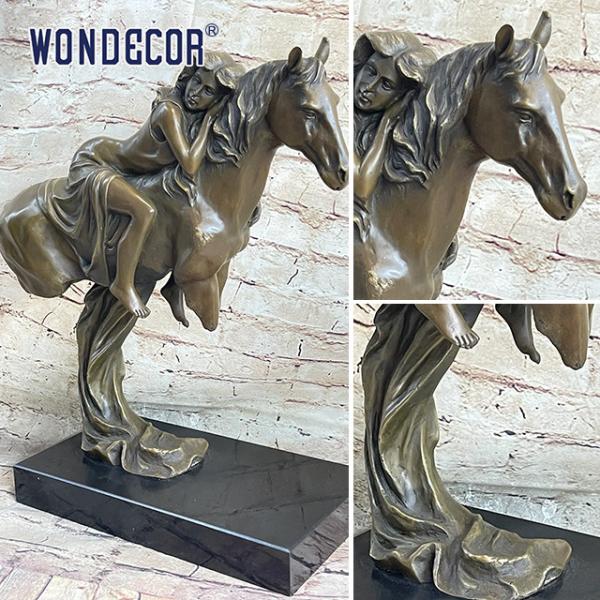 A Copper Sculpture Of A Young Girl On A Large Metal Art Horse Back Outdoors