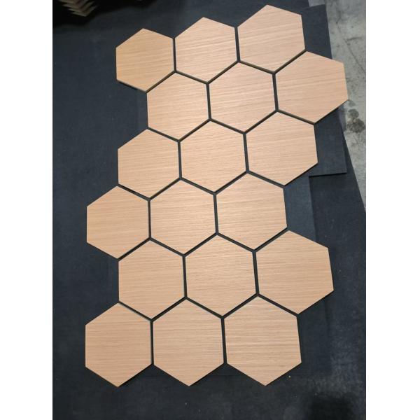 Wood grain hexagonal sound-absorbing panel close-up view