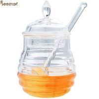 China Two Types Transparent Bee Honey Pot and Spoon With Stirring Rod Crystal Mini Honey Jar for sale