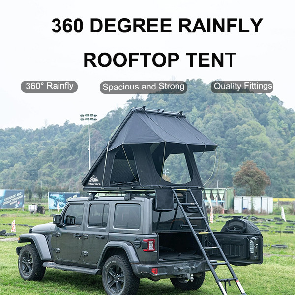 Hard shell aluminum roof top tent mounted on vehicle